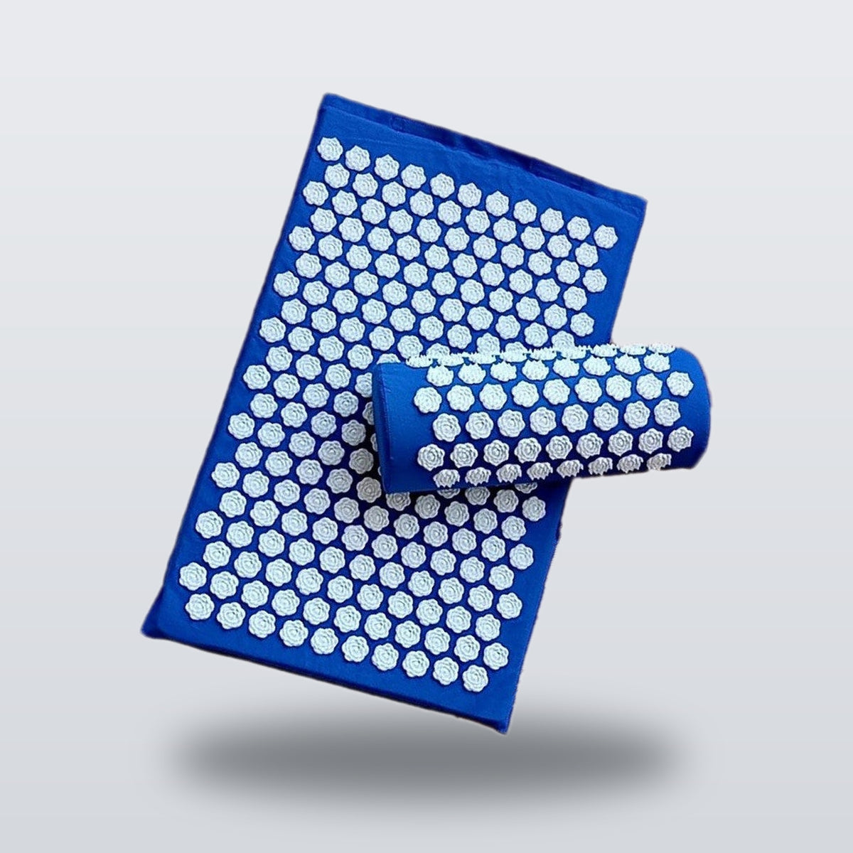 Acupressure mat and pillow set in blue