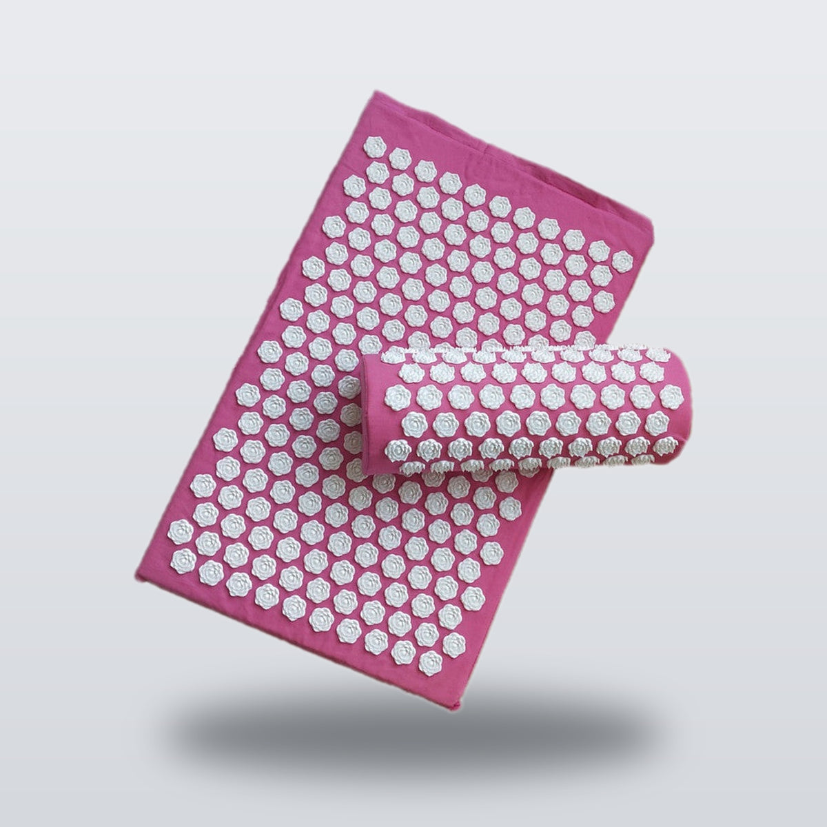 Acupressure mat and pillow set in pink