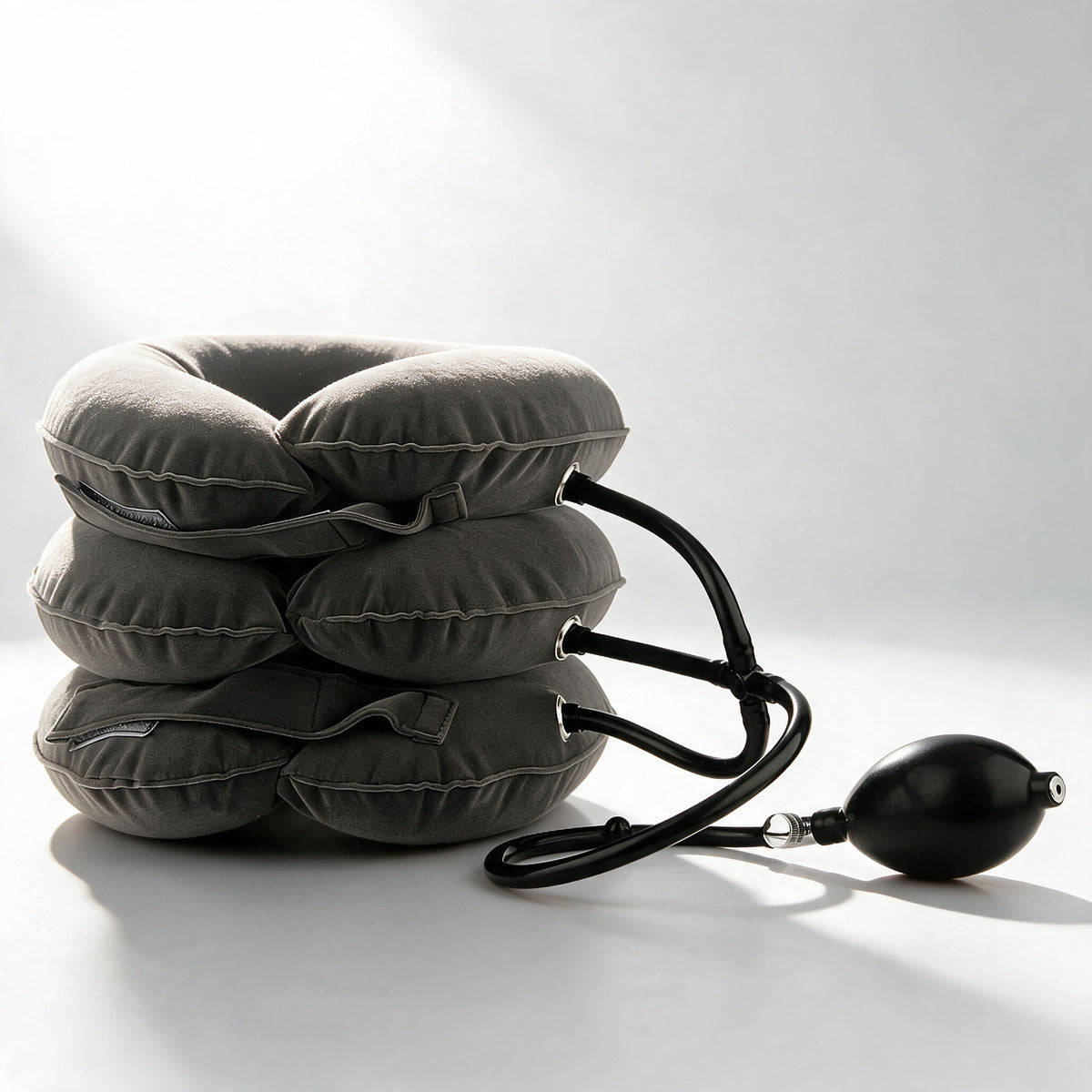 Inflatable neck rest with hand pump and twist valve in bright studio light